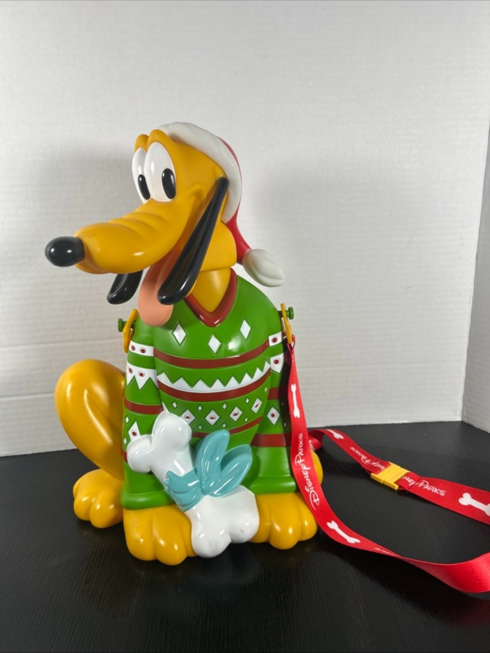 Disney parks popcorn bucket Pluto Green Sweater and Red Lanyard